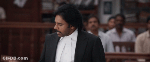 A Man In A Suit And White Shirt Is Giving A Speech GIF