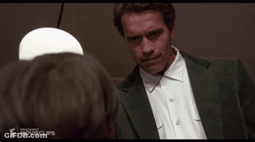 A Man In A Suit And White Shirt Is Looking At Another Man With The Words Thanks For The Tip Below Him GIF