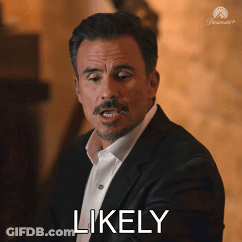 A Man In A Suit And White Shirt Is Making A Face And Says Likely GIF