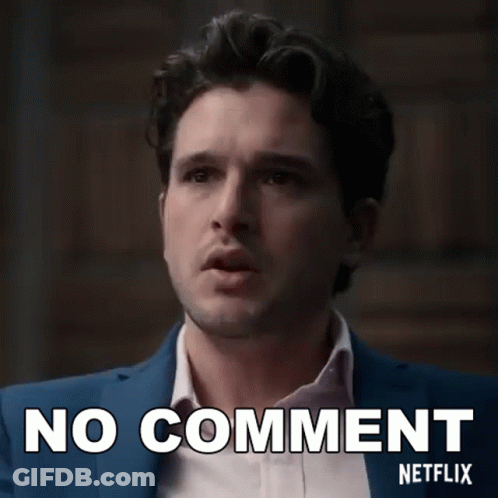 A Man In A Suit And White Shirt Is Making A No Comment Netflix Sign . GIF