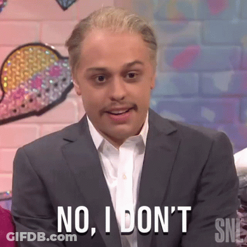 A Man In A Suit And White Shirt Is Saying No I Don 'T . GIF