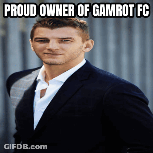 A Man In A Suit And White Shirt With The Words Proud Owner Of Gamrot Fc Above Him GIF