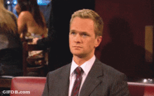 A Man In A Suit Giving The Middle Finger GIF