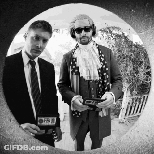 A Man In A Suit Has A Fbi Badge GIF