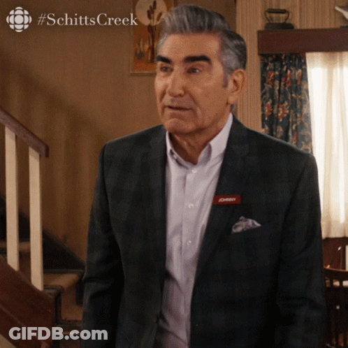 A Man In A Suit Has A Name Tag That Says ' Daddy ' On It GIF
