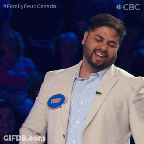 A Man In A Suit Has A Name Tag That Says Sunny On It GIF
