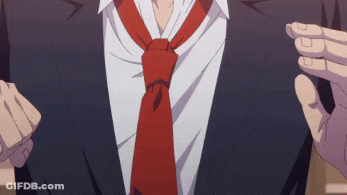 A Man In A Suit Has A Red Tie On His Neck GIF