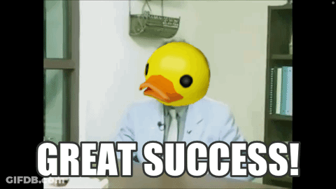 A Man In A Suit Has A Rubber Duck Head And Says Great Success GIF