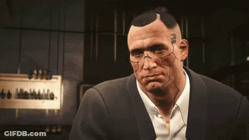 A Man In A Suit Has A Tattoo On His Face That Says ' Ss ' GIF