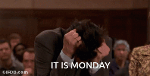 A Man In A Suit Has His Head In His Hands And The Words It Is Monday Behind Him GIF