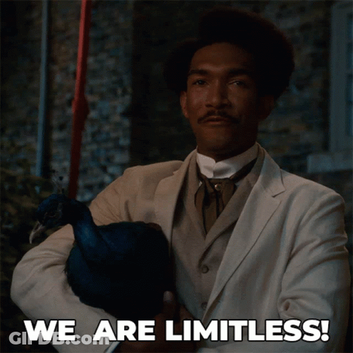 A Man In A Suit Holding A Peacock With The Words We Are Limitless Written Below Him GIF
