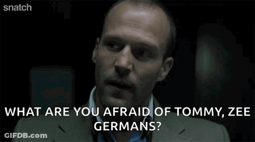 A Man In A Suit Is Asking What Are You Afraid Of Tommy Ze Germans GIF