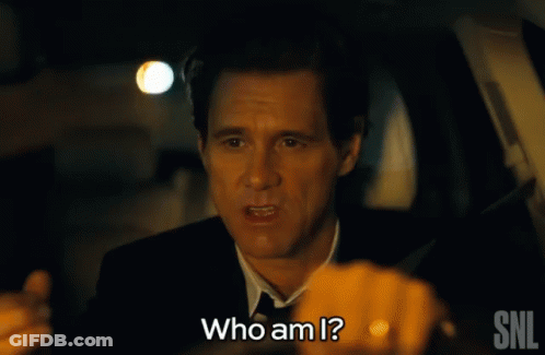 A Man In A Suit Is Asking Who Am I GIF