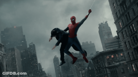 A Man In A Suit Is Being Lifted In The Air By A Spider-Man GIF