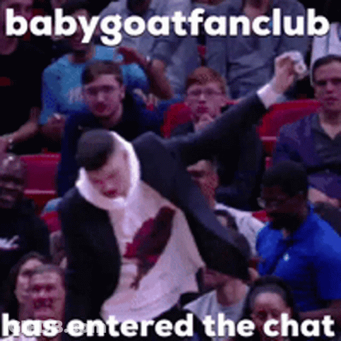 A Man In A Suit Is Being Thrown In The Air In Front Of A Crowd With A Caption That Says Babygoatfanclub GIF