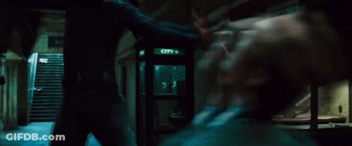 A Man In A Suit Is Brushing His Teeth With A Toothbrush . GIF