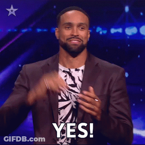 Man In Suit Clapping And Saying Yes GIF