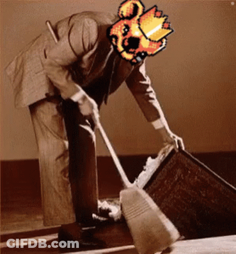 A Man In A Suit Is Cleaning The Floor With A Broom And Has A Pixelated Image Of A Fireball On His Head . GIF