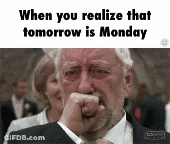 A Man In A Suit Is Crying With His Fist In His Mouth . GIF
