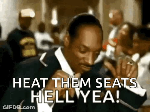 A Man In A Suit Is Dancing And Says Heat Them Seats Hell Yea GIF