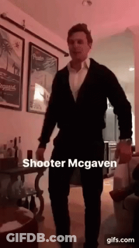 A Man In A Suit Is Dancing In A Living Room With A Caption That Says Shooter Mcgaven GIF