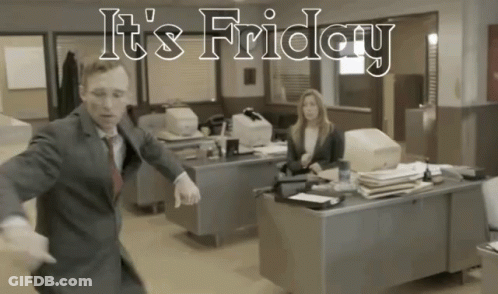 A Man In A Suit Is Dancing In An Office With The Words It 'S Friday GIF