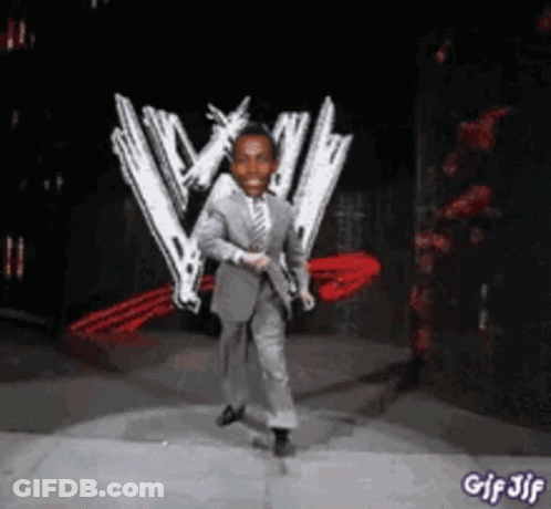 A Man In A Suit Is Dancing In Front Of A W Logo GIF