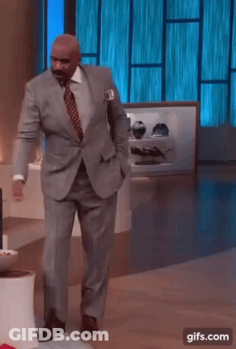 Man In Suit Dancing In Front Of Blue Window GIF