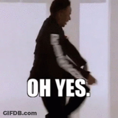 A Man In A Suit Is Dancing With The Words Oh Yes Behind Him GIF
