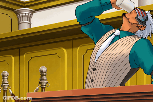 A Man In A Suit Is Drinking From A Cup GIF