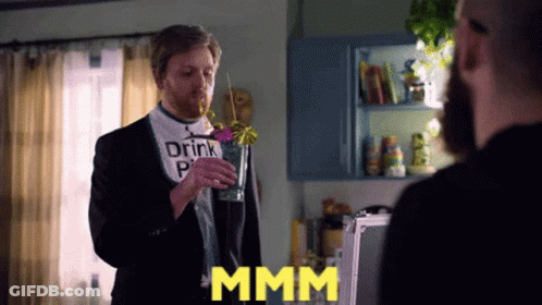 Man In Suit Drinking From Glass With Straw GIF