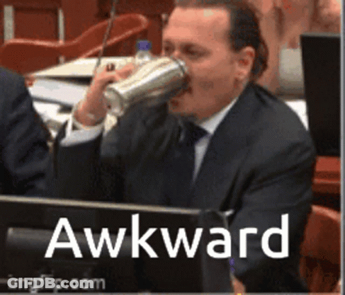 A Man In A Suit Is Drinking From A Shaker And The Word Awkward Is On The Bottom Right GIF