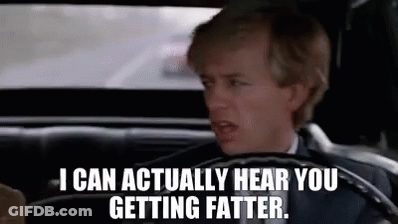 A Man In A Suit Is Driving A Car And Saying `` I Can Actually Hear You Getting Fatter . '' GIF