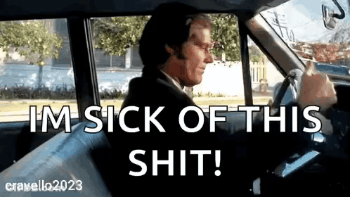 A Man In A Suit Is Driving A Car And Says I 'M Sick Of This Shit ! GIF