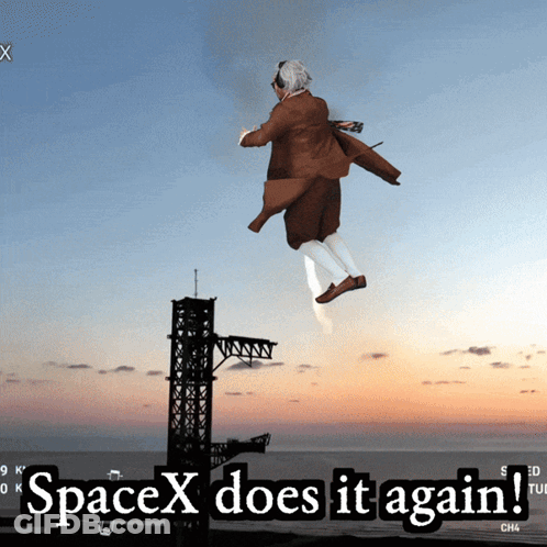 A Man In A Suit Is Flying In The Air With The Words Spacex Does It Again Below Him GIF