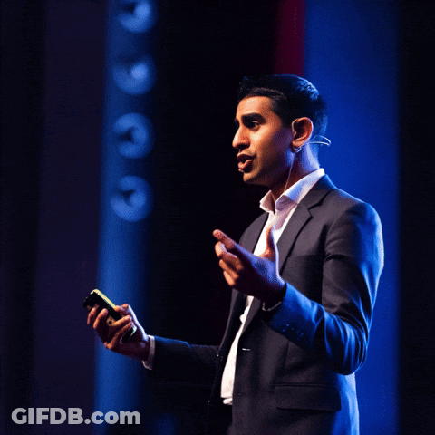 A Man In A Suit Is Giving A Speech With The Words " I Know Blockchain " Behind Him GIF