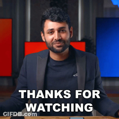 A Man In A Suit Is Giving A Thanks For Watching Sign GIF