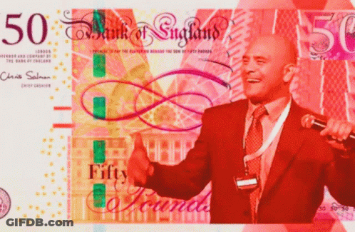 A Man In A Suit Is Giving A Thumbs Up In Front Of A 50 Bank Of England Bill GIF
