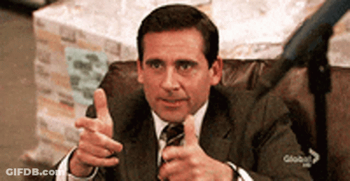 A Man In A Suit Is Giving A Thumbs Up GIF