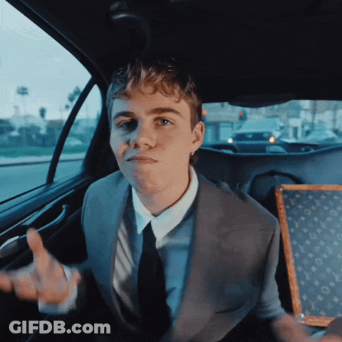A Man In A Suit Is Giving The Middle Finger GIF