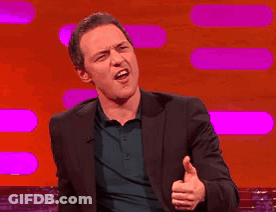 A Man In A Suit Is Giving The Thumbs Up Sign GIF