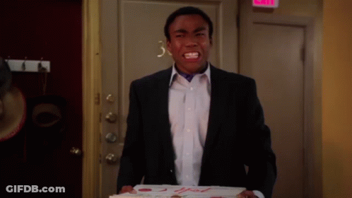 A Man In A Suit Is Holding A Box Of Pizza That Says 2Nd Fresh Pizza On It GIF