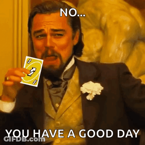 A Man In A Suit Is Holding A Card That Says Uno GIF