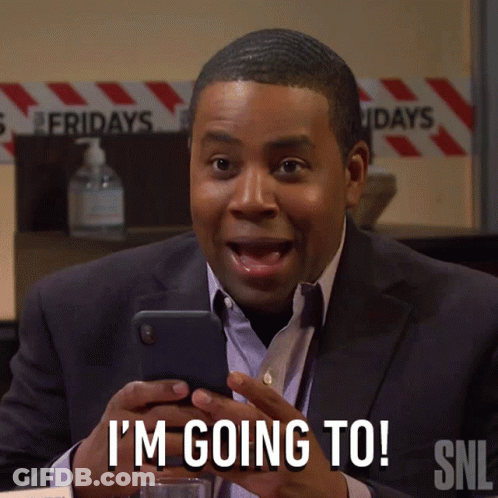 A Man In A Suit Is Holding A Cell Phone And Says I 'M Going To Snl GIF