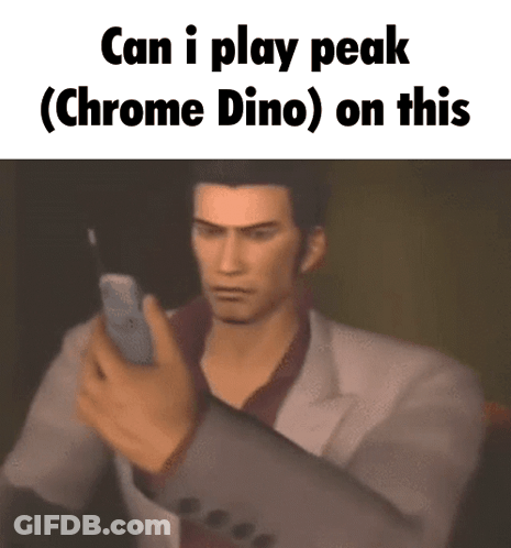 A Man In A Suit Is Holding A Cell Phone With The Words Can I Play Peak ( Chrome Dino ) On This Below Him GIF
