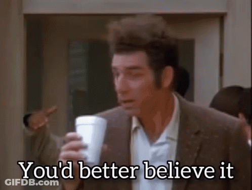 A Man In A Suit Is Holding A Cup Of Coffee And Saying You 'D Better Believe It . GIF