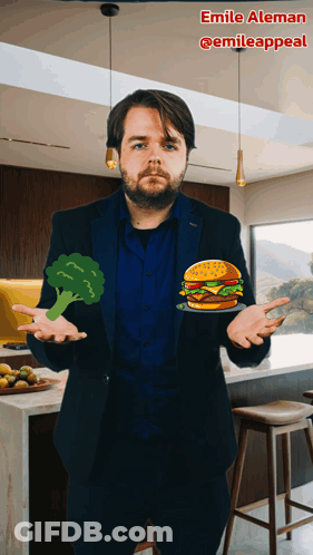 A Man In A Suit Is Holding A Hamburger And Broccoli GIF