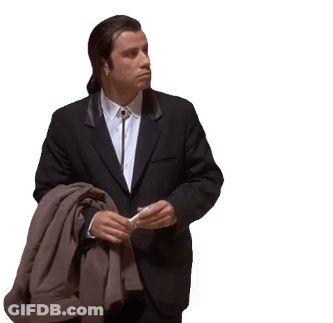 A Man In A Suit Is Holding A Jacket And A Cigarette . GIF