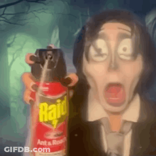 A Man In A Suit Is Holding A Raid Ant And Roach Spray . GIF
