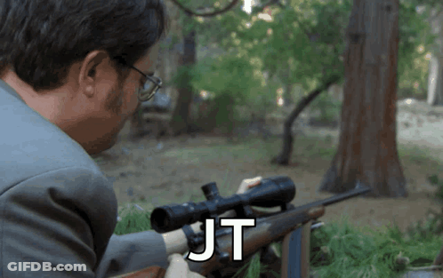 Man In Suit Holding Rifle JT GIF